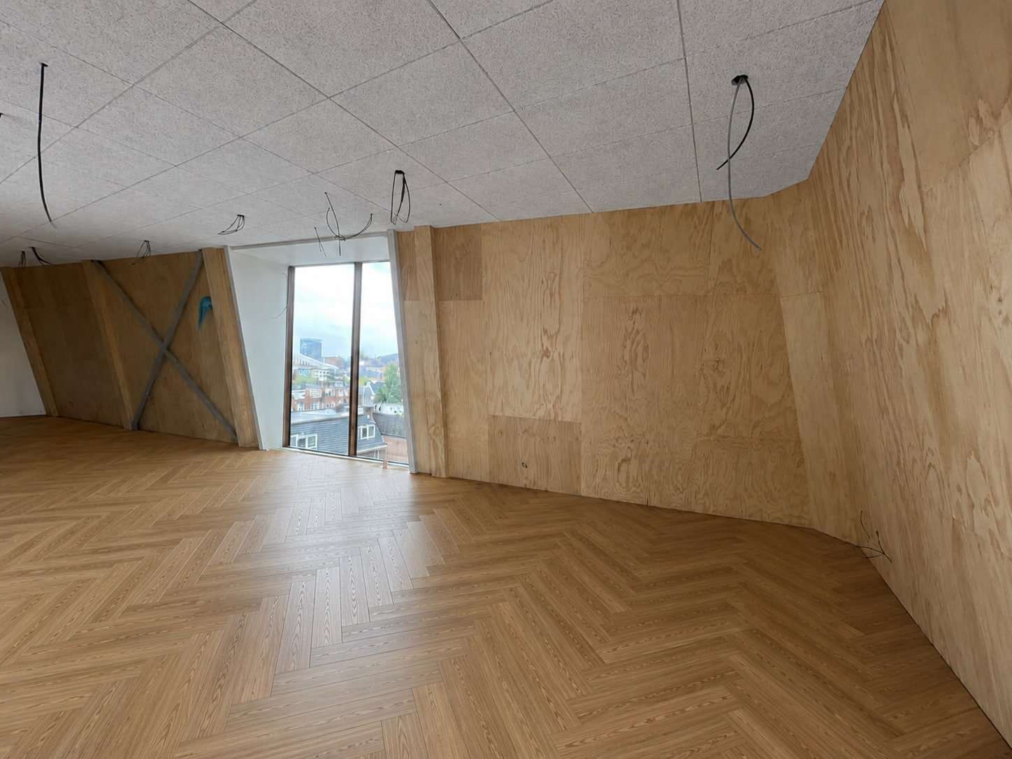 Complete living room renovation — herringbone floor & wooden walls